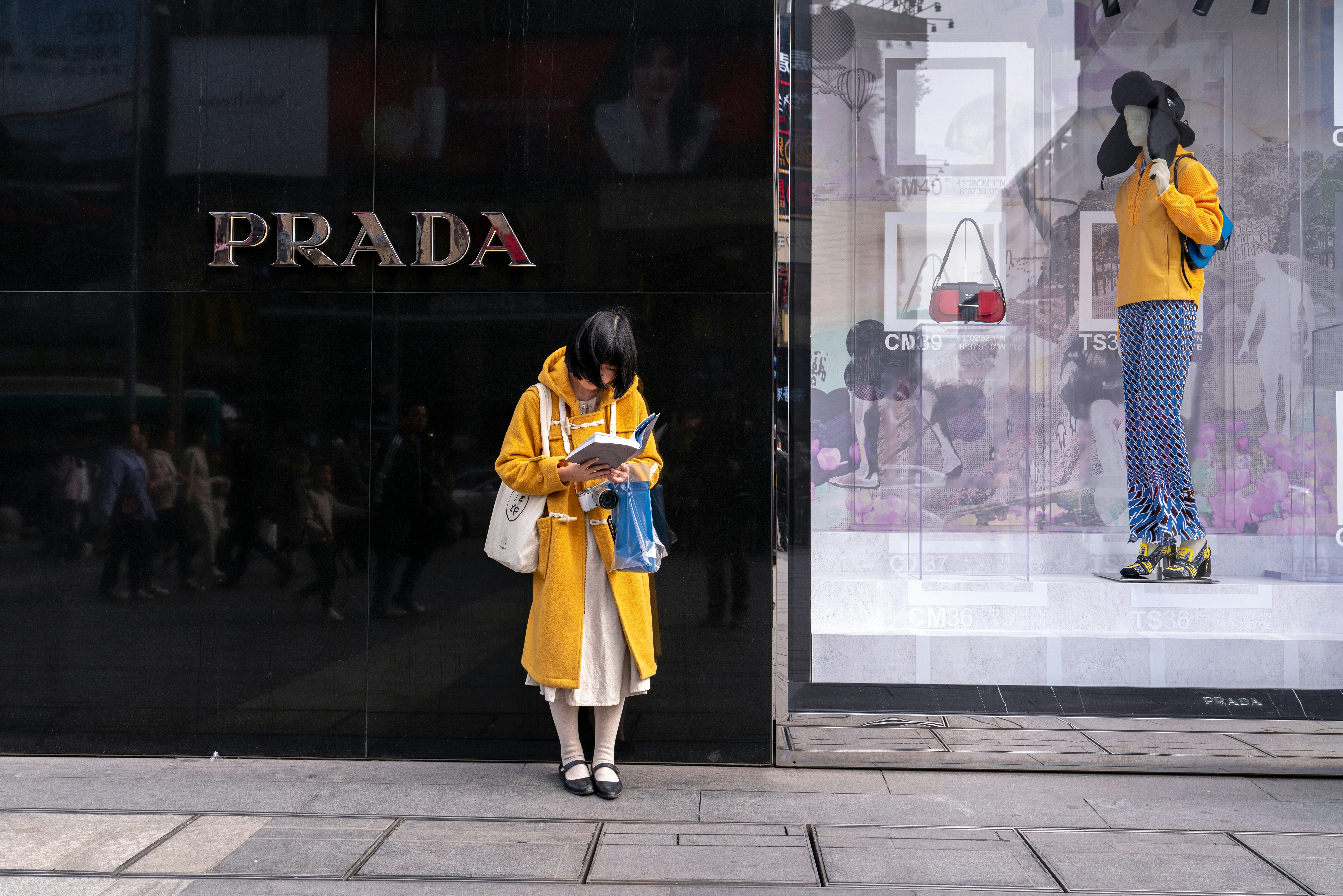 A shopper outside a Prada store in Chengdu. Shutterstock.