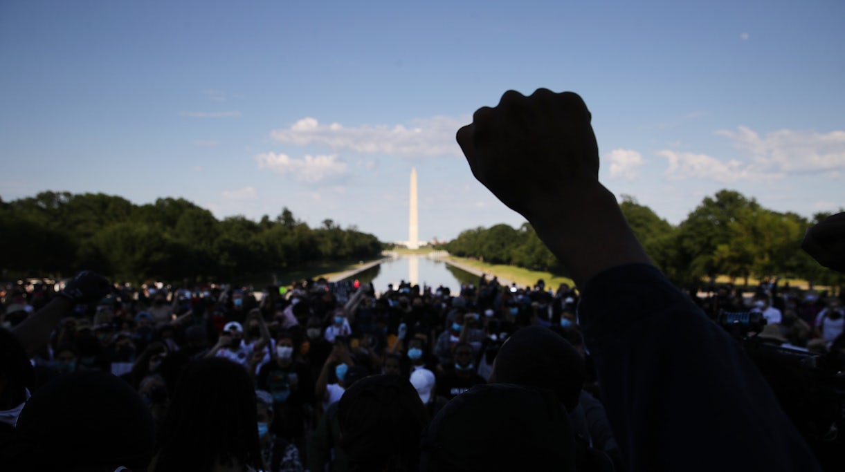 A demonstrator at the Lincoln Memorial during a peaceful protest against police brutality and the death of George Floyd, on June 2, 2020 in Washington, DC. | Source: Getty Images 